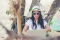 Lifestyle freelance woman using laptop working and relax on the beach.ÃÂ 